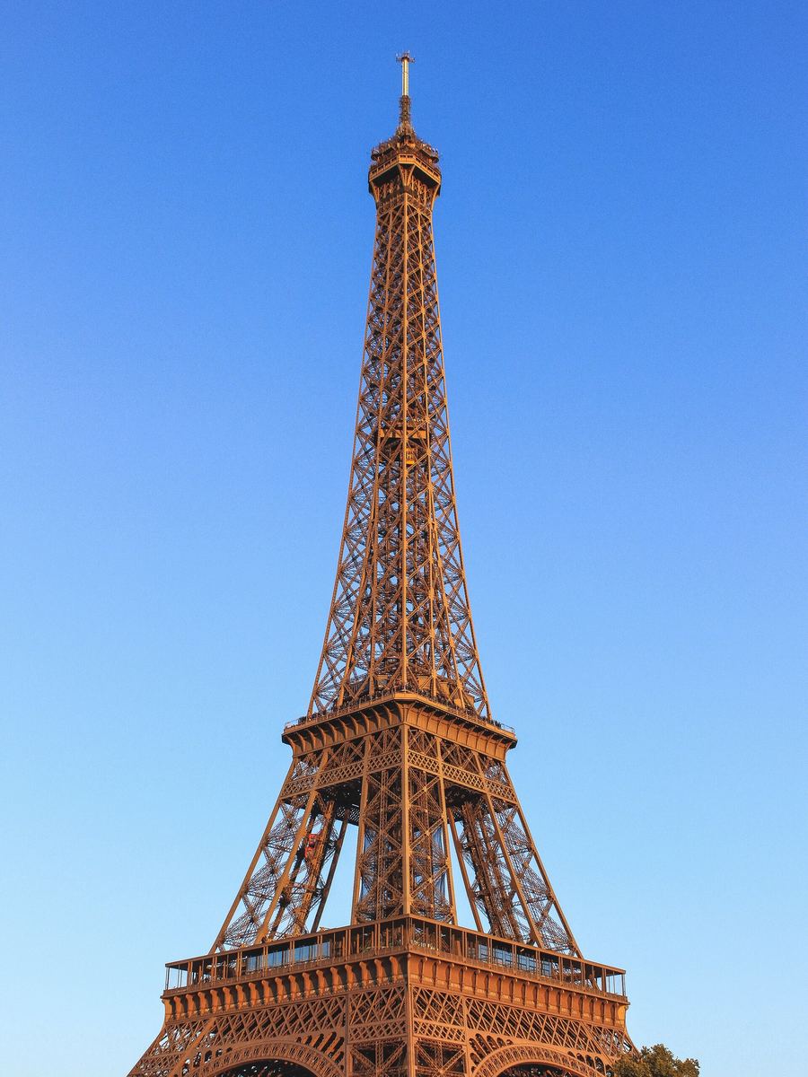 The Eiffel Tower against a clear blue sky